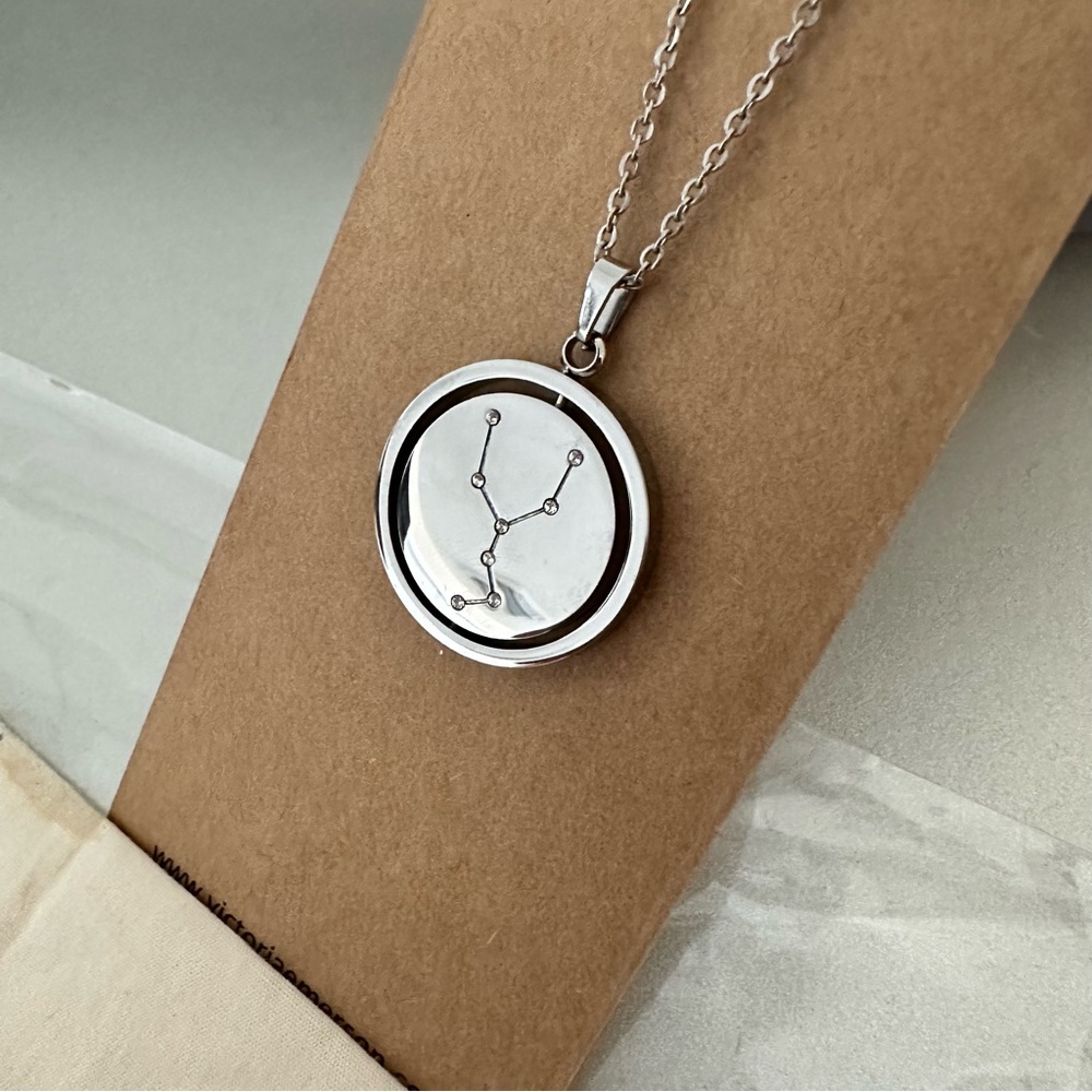NWT TAURUS SPINNING PENDANT NECKLACE SILVER